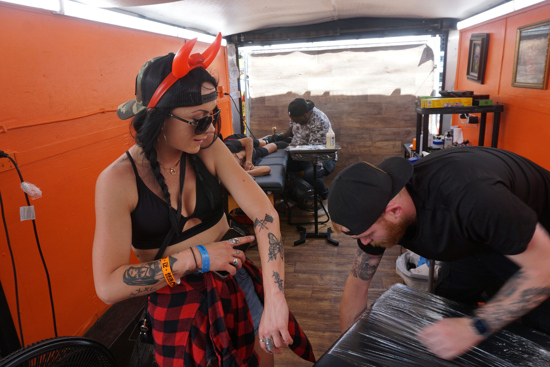 Artists from around the country visit the Weirs to ink tattoos during Motorcycle Week